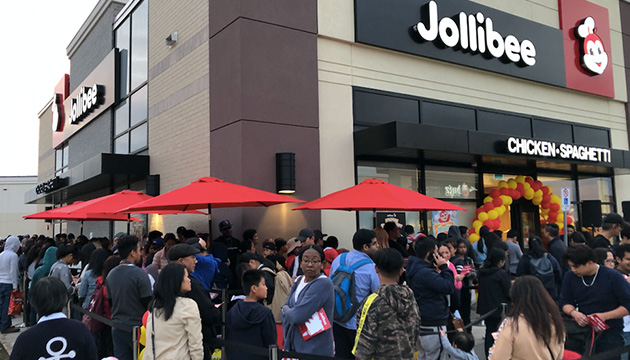 Thousands line up outside the new store on opening day, September 6.