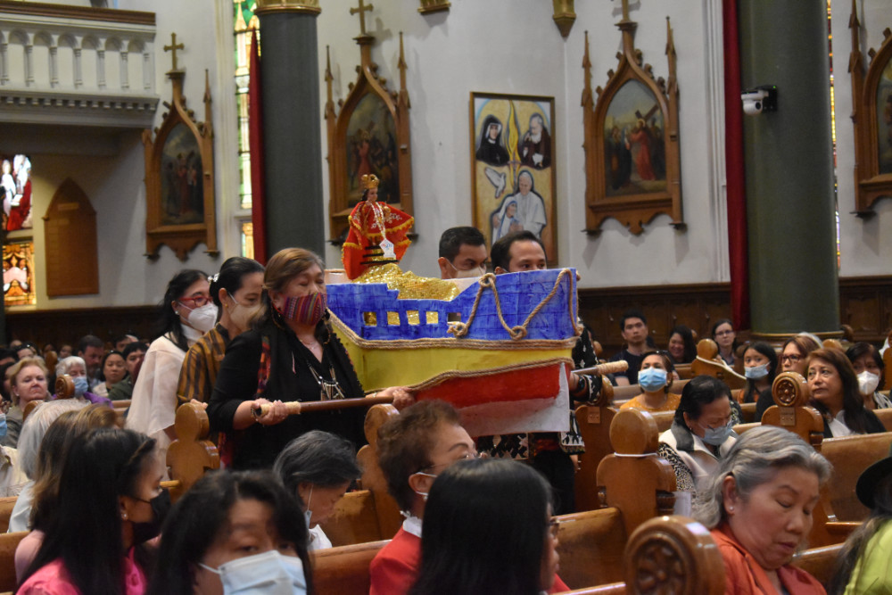 Members of the Victoria Catholic community bring in an image of the beloved Sto. Nino.