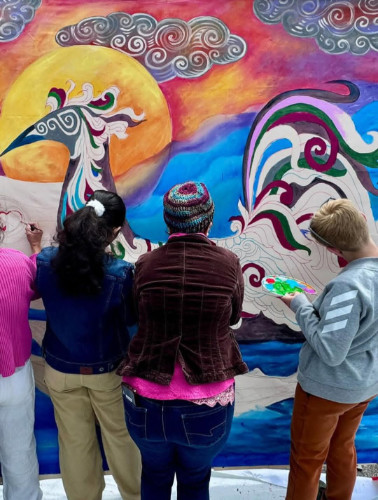 Participants of an art workshop for healing organized by the Philippine Artists Network for Community Integrative Transformation (Pancit) paint a mural at the Pinoy Festival 2025 on June 14 in Burnaby. Photo courtesy of Migrante BC.